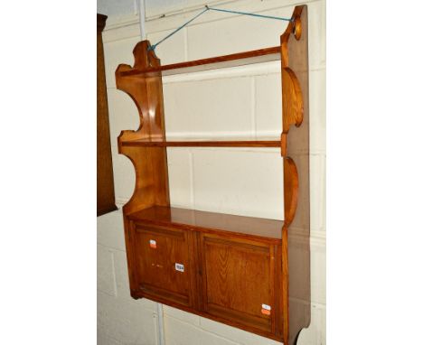 AN EDWARDIAN SATINWOOD WALL CABINET/SHELF