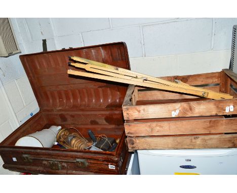 A VINTAGE SCUMBLED TIN TRUNK, with miscellanous contents together with a wooden crate, a pair of cast iron bench ends and woo