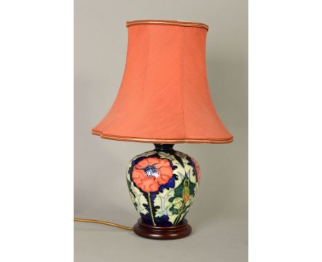 A MOORCROFT POTTERY TABLE LAMP, stylized Poppy pattern designed by Rachel Bishop, mounted on circular wooden base, approximat