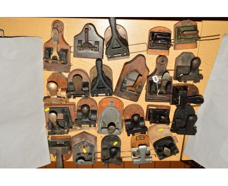 A COLLECTION OF TWENTY THREE VINTAGE DOUBLE HOLE PUNCHES, all mounted on wooden blocks, including The Bullfinch '62 Punch, a 