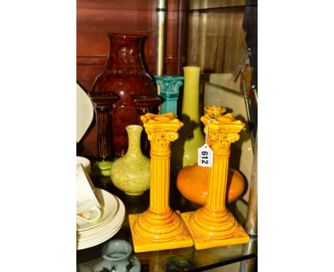 A PAIR OF BURMANTOFTS FACIENCE POTTERY CANDLESTICKS, impressed No1198 and BF to base, height 21cm, together with a bottle vas