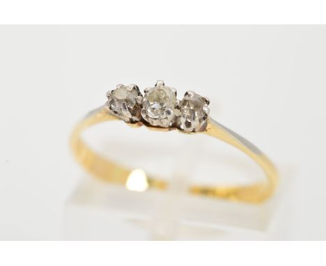 A THREE STONE DIAMOND RING designed as a three claw set graduated old cut diamonds to the tapered shoulders and plain band, e