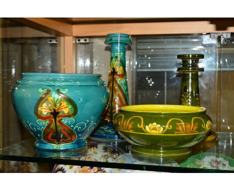 FOUR PIECES OF WARDLE POTTERY HAVING TUBE LINED DECORATION, POSSIBLY DESIGNED BY FREDERICK HURTON RHEAD, to include two candl