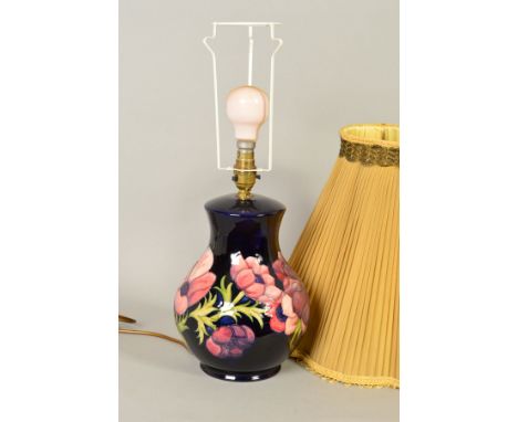 A MOORCROFT POTTERY BULBOUS TABLE LAMP, 'Anemone' pattern on blue ground, impressed marks to base, height 26cm (not including