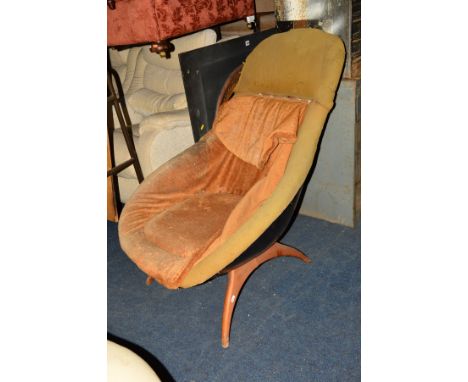 A DISTRESSED LURASHELL 1960'S LOUNGE CHAIR on a shaped teak base (no label to stool to comply with The Furniture and Furnishi