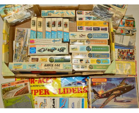 A QUANTITY OF UNBUILT BOXED PLASTIC CONSTRUCTION KITS, mixture of aircraft, racing cars and model railway rolling stock and a