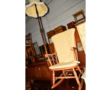 A MODERN BEECH SPINDLE BACK ROCKING CHAIR, two framed watercolours, circular gilt wall mirror and a standard lamp (5)