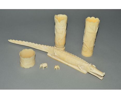 A SMALL GROUP OF LATE VICTORIAN/EDWARDIAN IVORY, including a napkin ring carved with name, a crocodile and two posy vases, s.