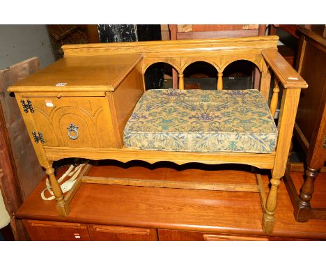 A LIGHT OAK TELEPHONE TABLE/SEAT together with a pine standard lamp and a ceramic table lamp (3)