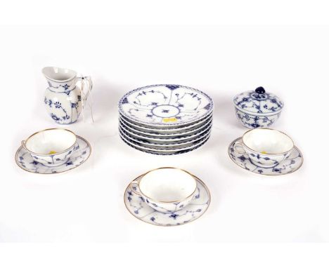 A Royal Copenhagen Blue Fluted Half Lace Border part tea service, comprising: three cups and saucers, seven side plates, crea