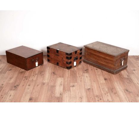A collection of three wooden chests, comprising; a small painted trunk, 67 x 40 x 32cm high, a pine and metal strapwork chest