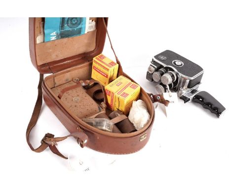 A Bolex Paillard camera, contained in a leather case, with three rolls of film. 