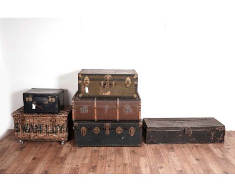A collection of six vintage trunks, comprising a wicker baskets trunk on castors, 72 x 52 x 42cm high, together with a wood a