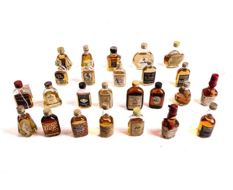 A collection of whisky miniatures, many in hip flask decanter bottles, including: Oban Unblended Highland Malt Scotch Whisky,