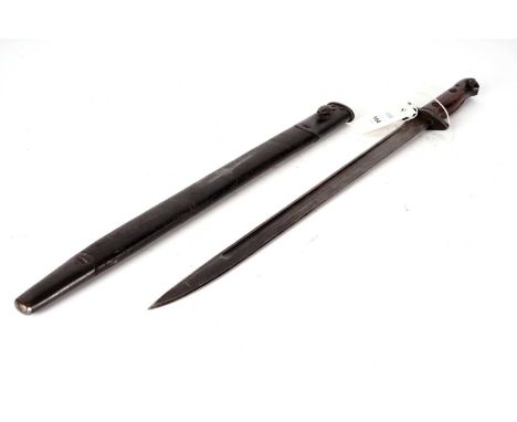 A British 1907 pattern bayonet, single edge blade with wooden grip, with fitted metal mounted leather scabbard, 58cms overall