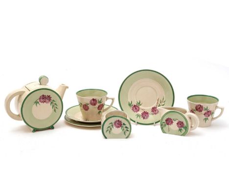 An Art Deco Clarice Cliff 'Honeyglaze' tea service, each piece painted with pink flowers within green band borders, comprisin