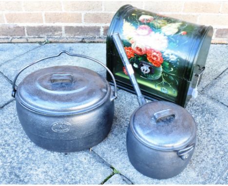 A DOME TOP TRUNK WITH BARGEWARE STYLE FLORAL DECORATION  a four gallon oval lidded pot, and another large saucepan and lid