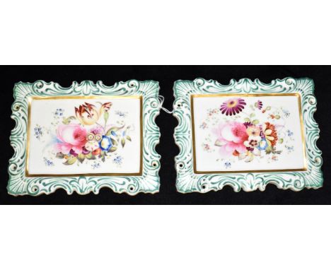 A PAIR OF VICTORIAN CERAMIC PLAQUES  each painted with floral sprays within shaped border, 16cm x 13cm Condition Report : goo