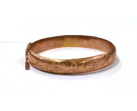 A 9CT ROSE GOLD GEORGE V BANGLE  the half patterned bangle measures approx. 6.5cm in diameter and 1.2cm wide, hallmarked for 