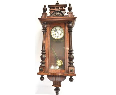 A CONTINENTAL WALNUT CASED WALL CLOCK  with 8-day spring driven movement, 35cm wide 102cm high Condition Report : good condit