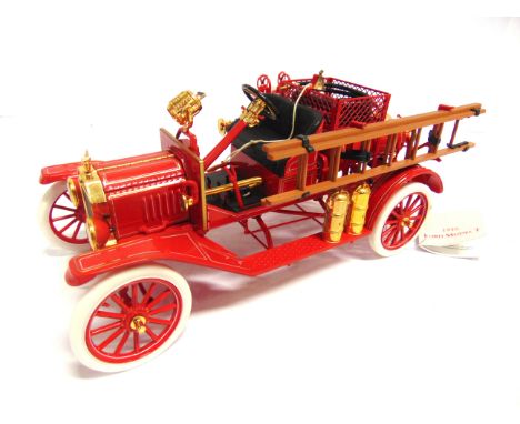 FOUR FRANKLIN MINT DIECAST MODEL FIRE SERVICE VEHICLES  comprising a 1/32 scale 1922 Ahrens-Fox R-K-4 Pumper; 1/24 scale 1912