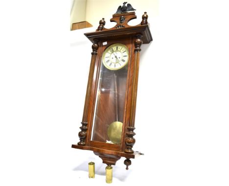 A GUSTAV BECKER TWIN WEIGHT CONTINENTAL WALL CLOCK  the dial with Roman numerals and subsidiary seconds dial, the walnut case