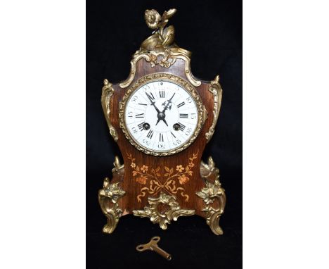 A FRENCH GILT METAL MOUNTED MANTEL CLOCK  in marquetry decorated case, the 8-day movement by A D Mougin striking on a coiled 
