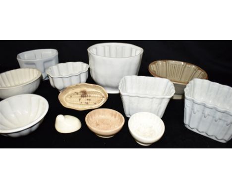 TWELVE ASSORTED CERAMIC JELLY MOULDS