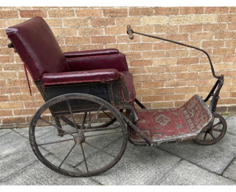 A LATE 19TH CENTURY BATH CHAIR BY CARTER OF LONDON  the black-painted body with gold lining, maroon leatherette upholstery, a