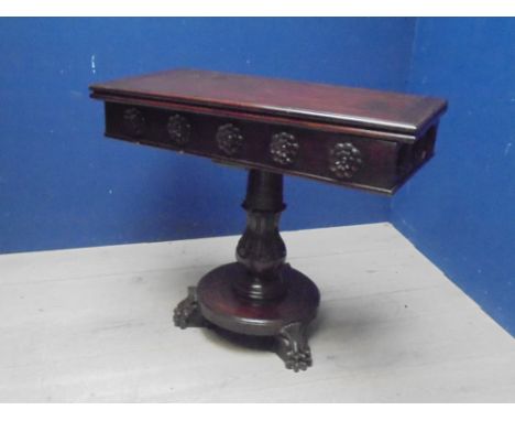 William IV mahogany fold over oblong card table with fleur de lys decoration on moulded pedestal to 3 paw feet, with green ba