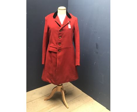 Vintage gentleman's red hunting coat, traditional long length, with black velvet collar, and brass buttons embossed with fox 