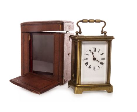 EARLY 20TH CENTURY FRENCH BRASS CARRIAGE CLOCK, the white enamel dial with Roman numerals, five glass case, swing handle, rai