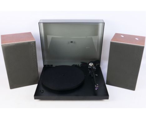 A Rega Planar 3 turntable in black with a pair of Bang & Olufsen Beovox MC35 speakers. [3]. [W]Condition Report: Turntable po