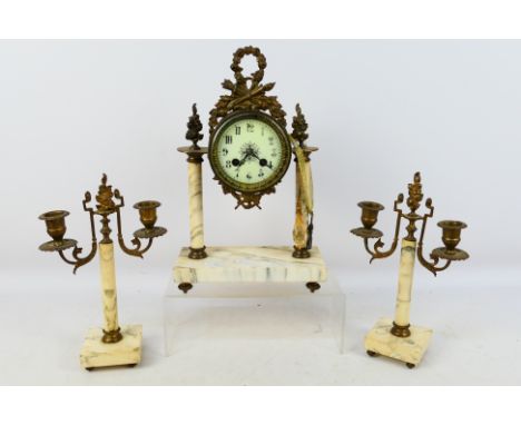 A French mantel clock garniture, the bell striking clock with white 4" enamel dial, Arabic numerals  and matched fleur de lys