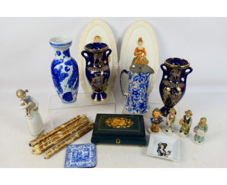 Ceramics to include Lladro figure, Goebel Hummel figure, vases, two plaster wall plaques and other. [W]