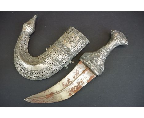 A Middle Eastern Jambiya Knife / Dagger Housed Within A White Metal Decorative Scabbard With Matching Handle. 