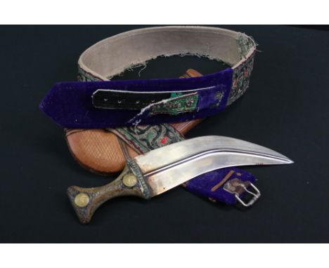 A Middle Eastern&nbsp;Jambiya Knife / Dagger Housed Within A Leather Sheath With Ornate Belt.