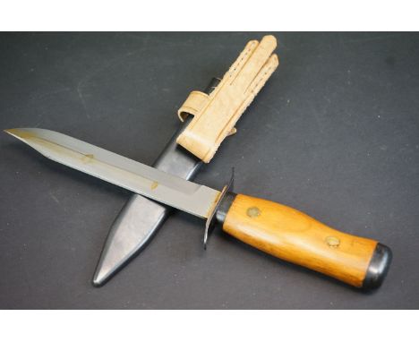 A Polish Military Combat Knife Complete With Scabbard, Matching Numbers To Scabbard And Blade A02739, Dated 1956. 