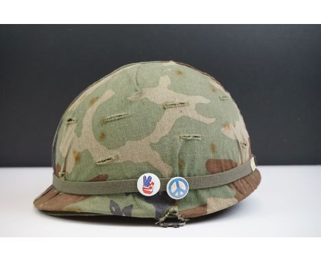 A British Military Helmet Complete With Liner And Camouflage Cover. 