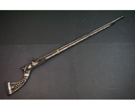 An Antique Afghan Muzzle Loading Rifle With Mother Of Pearl Inlay And British Flintlock Action. 