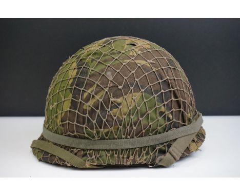 A British Military Helmet Complete With Liner, Camouflage Cover &amp; Mesh Netting. 