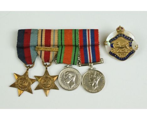 A British World War Two Miniature Medal Group Of Four To Include The 1939-45 British War Medal, The 1939-45 Defence Medal, Th