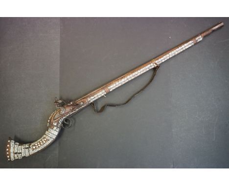 A 19th century Afghan Rifle With Heavy Mother Of Pearl Inlay. 