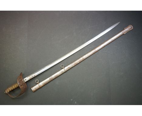 A Victorian British Military Dress Sword and Scabbard, by Sexton of Dawson St., Dublin, the engraved 32 1/2'' blade with a st