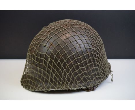 A British Military Helmet Complete With Liner, Mesh Netting And Strap. 