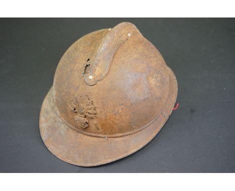An Original French M15 Helmet With Original Badge And Liner, In Battlefield Relic Condition. 