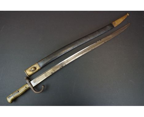 A Pre World War One Sword Bayonet With Brass Handle And Hooked Quillion, Complete With Original Scabbard. 