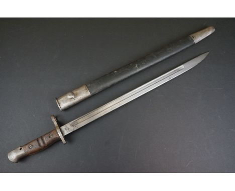 A United States World War One Bayonet By Remington Complete With Leather Scabbard. 