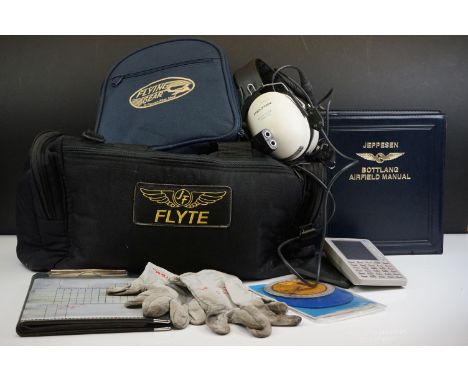 A Collection Of Pilots Flight Equipment To Include Headphones And Air Field Manual Together With A Pair Of Pilots Gloves Sign