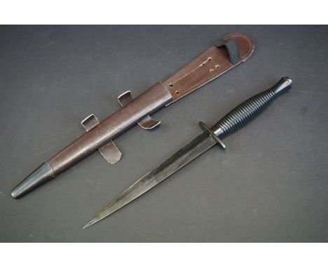 A Fairbairn Sykes Commando Dagger, Marked Sheffield, England Together With The British Broad Arrow Mark And Complete With Sca